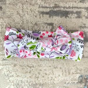 Baby bow with spring flowers.